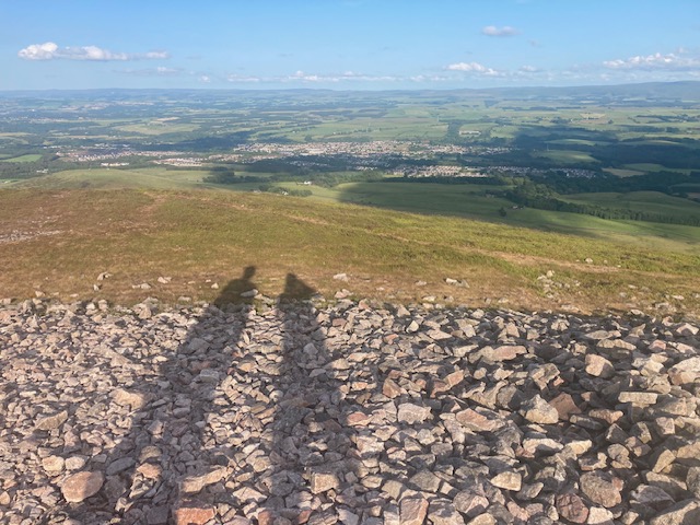 Shadows of runners on top of Carnethy
