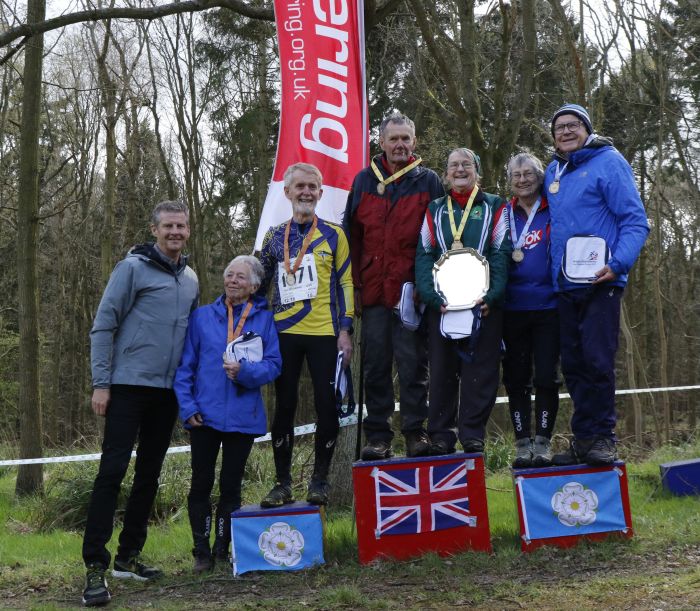 Eleanor on top of the W80 podium, ahead of Clare Fletcher (BOK) and Ruth Rhodes (SO). Steve Cram (left) awarded the prizes.