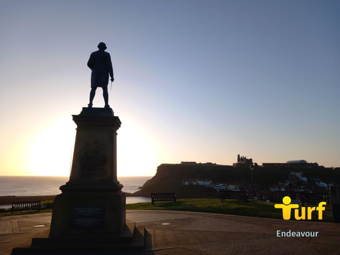 Turfing in Whitby. Looking across the bay from the Captain Cook memorial statue to the famous Whitby Abbey, sitting atop a 199-step staircase.